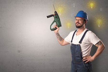 Craftsman with tool and new idea symbol in his hand.