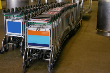 Trolleys by the railway at an airport