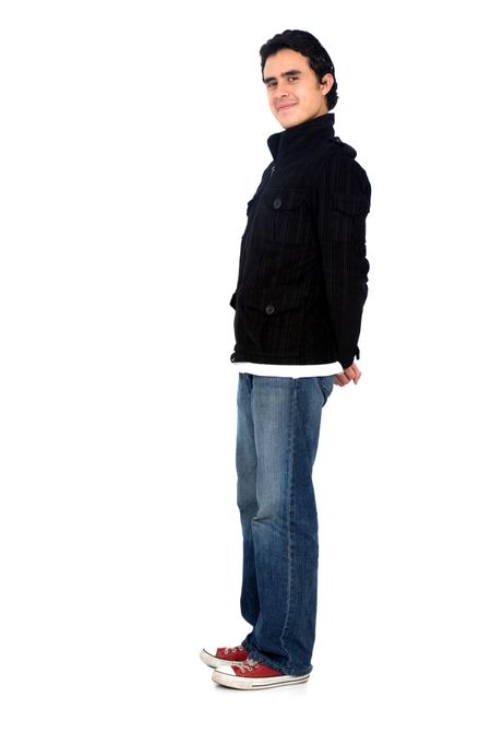 Casual friendly man in blue jeans standing – isolated over a white background