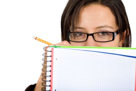 girl who is a student writing on a note pad and wearing glasses isolated over a white background