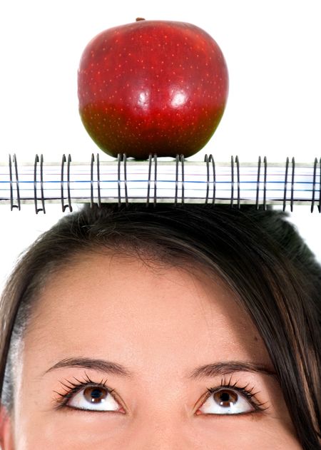 casual female student with a notebook on her head - over a white background