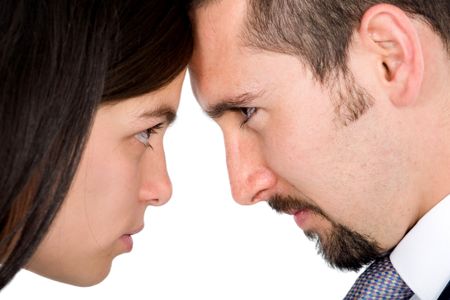 couple looking at each other angrily over a white background