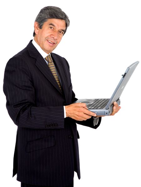business man on a laptop smiling - isolated over a white background