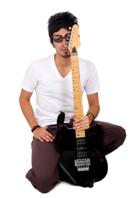 casual man holding an electric guitar isolated over a white background
