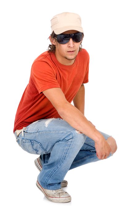 casual man portrait wearing a cap and sunglasses - isolated over a white background