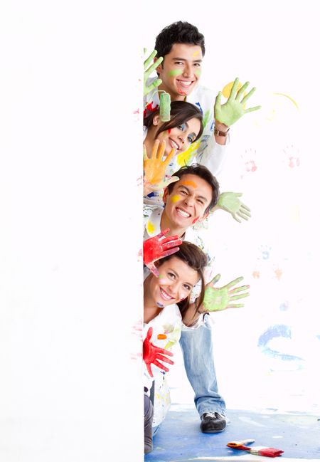 Group of painters with paint leaning out from a banner