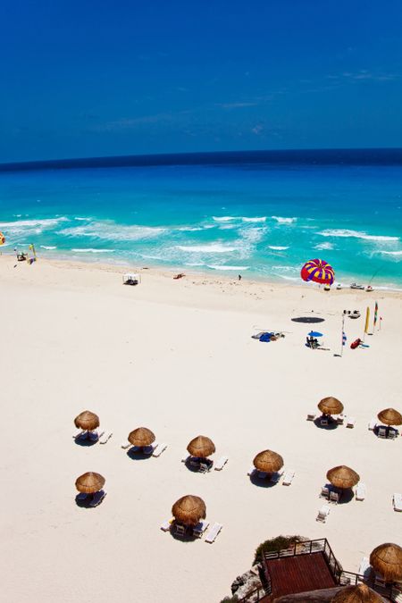 Beautiful scene of a hot beach at summer with chairs