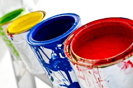 Paint cans on different colors - isolated over white
