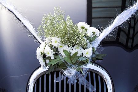 close up of flowers on a wedding car
