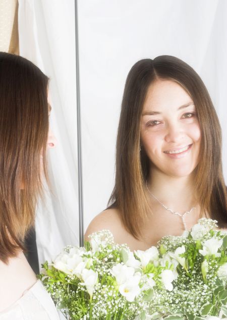 beautiful bride smiling on a mirror - soft focus