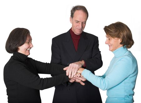 business team with their hands together over white