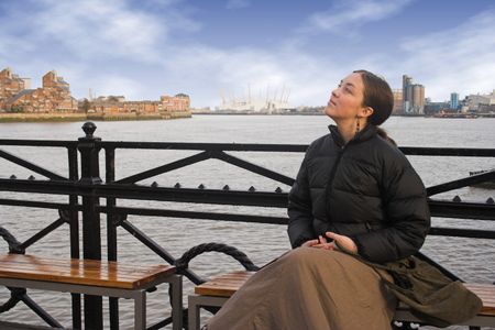 beautiful woman by the river thames