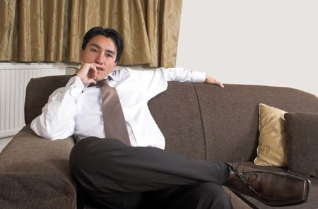 business man sitting on a sofa