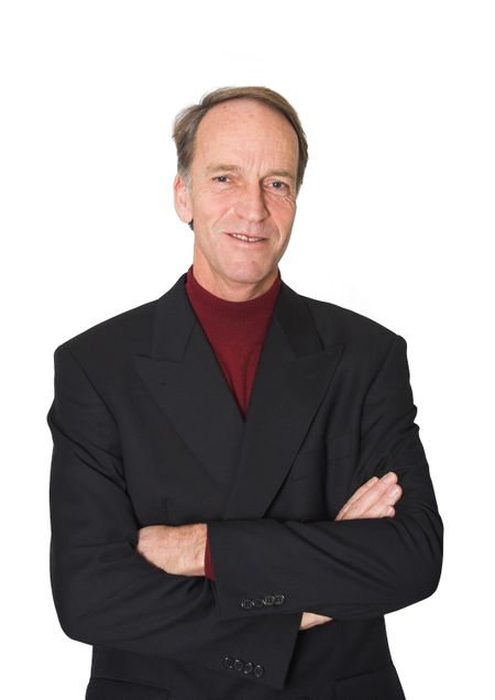 Business man portrait with crossed arms over white