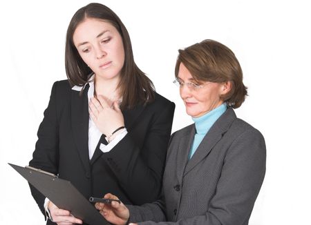 business women analysing notes on a pad