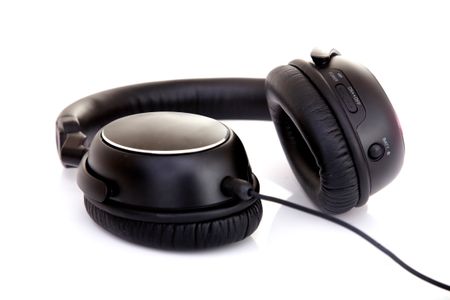 black headphones isolated over a white background