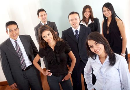 Business team in an office with a businesswoman leading