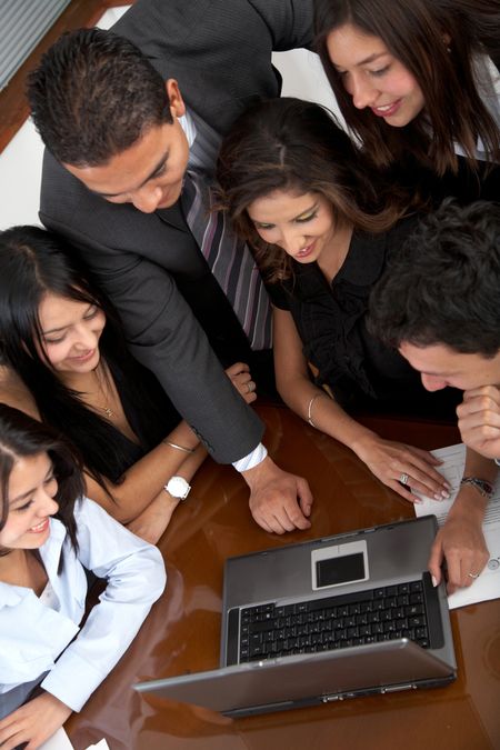 business team in an office laptop computer - meeting