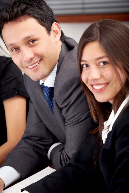 business people smiling in an office environment