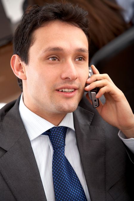 Business man talking on the phone in his office