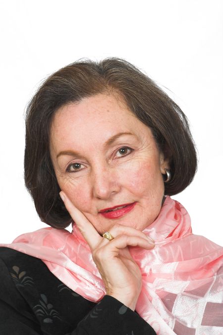 confident business woman on a white background with her hand on her face