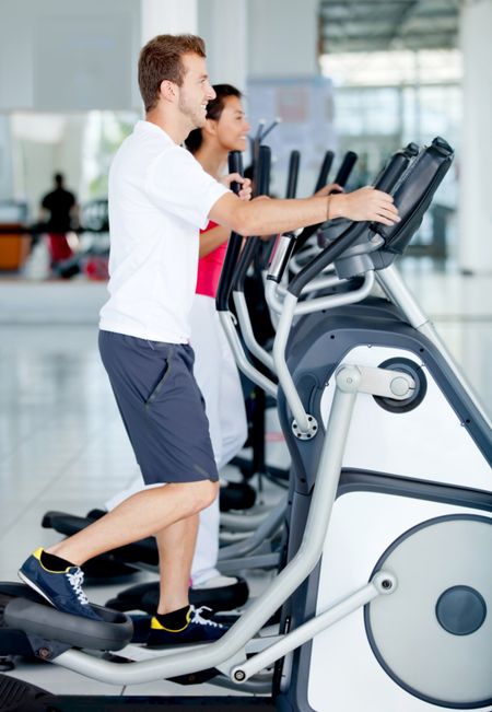 Group of people at the gym exercising on the xtrainer machines