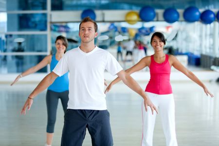 Group of people at the gym stretching