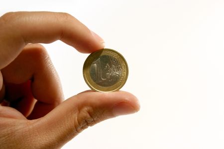 An Euro coin held by 2 fingers