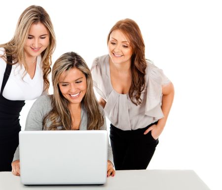Group of business women working on a laptop - isolated over a white background