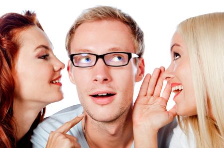 Beautiful women telling a secret to a man to his ear - isolated over a white background
