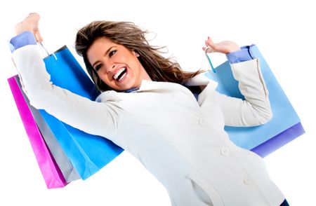 Very happy shopping woman holding bags - isolated over a white background