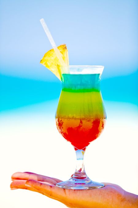 Colorful tropical cocktail looking very provocative at the beach