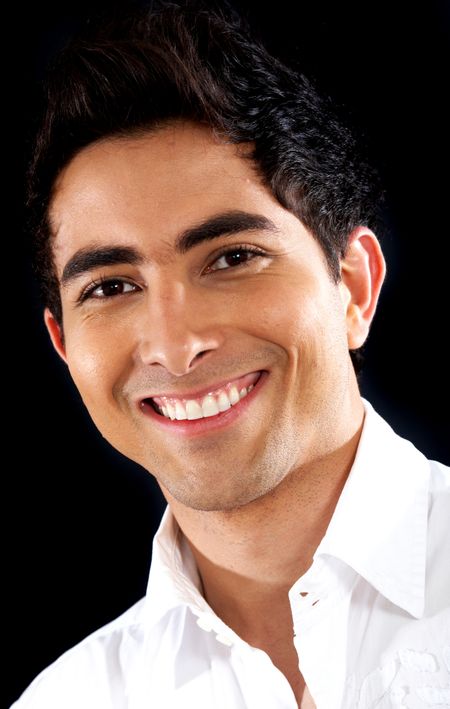 casual man portrait smiling - isolated over a black background
