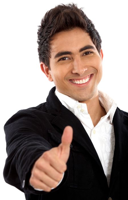 casual man smiling doing the thumbs up sign over a white background