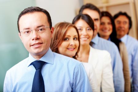 Business people in an office lead by a male
