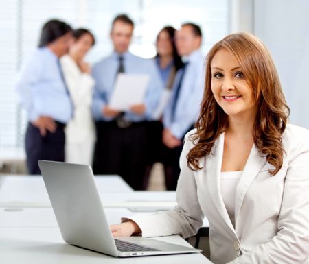 Corporate business worker at the office with a laptop