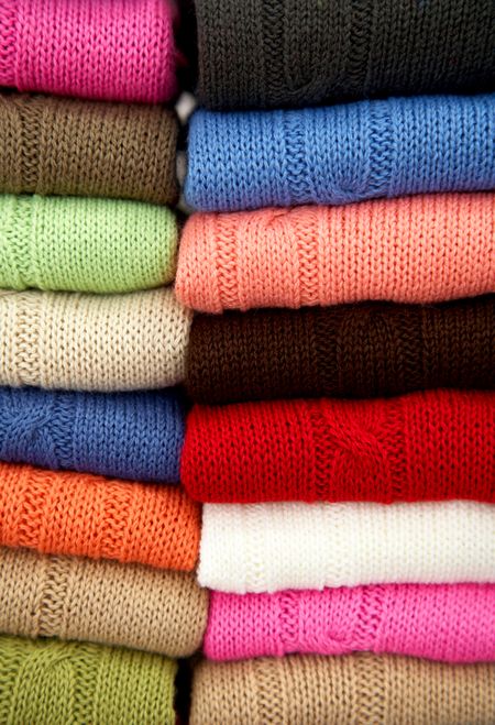 multi colour woolen sweaters in a retail store