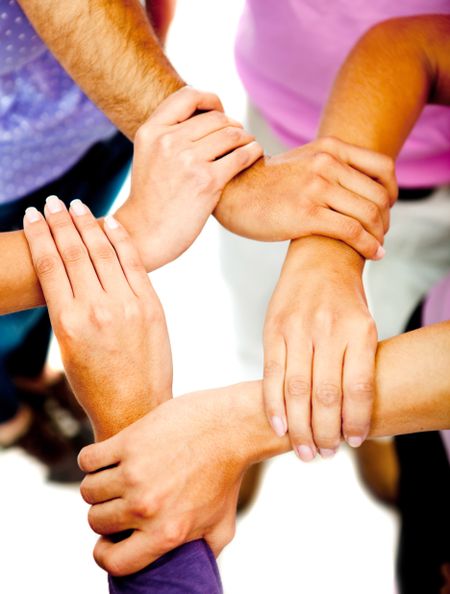 Group of people holding hands - teamwork concepts