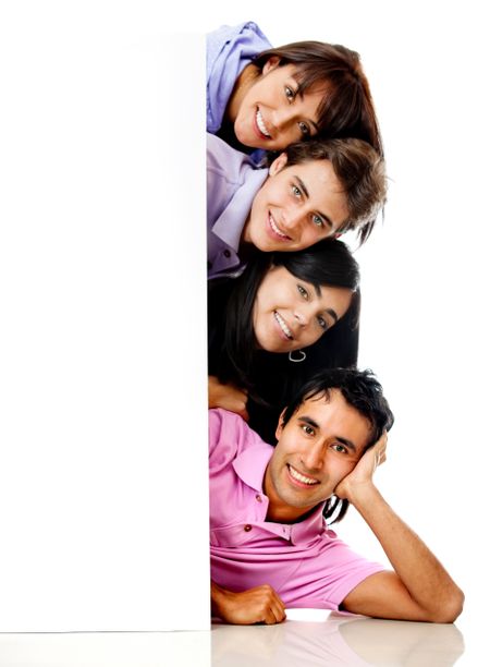 Group of happy people with a banner smiling - isolated over a white background