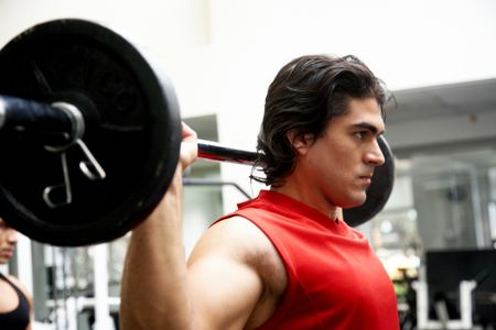 man-lifting-weights-gym-looking-serious-8965768 man lifting weights at the gym looking serious