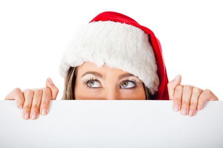 Thoughtful female Santa holding a banner  ? isolated over a white background