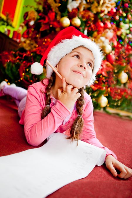 girl-writing-letter-santa-christmas-wishes-89735605 Girl writing a letter to Santa with her Christmas wishes