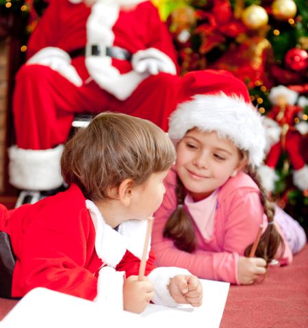 Children writing a Christmas letter for Santa Claus
