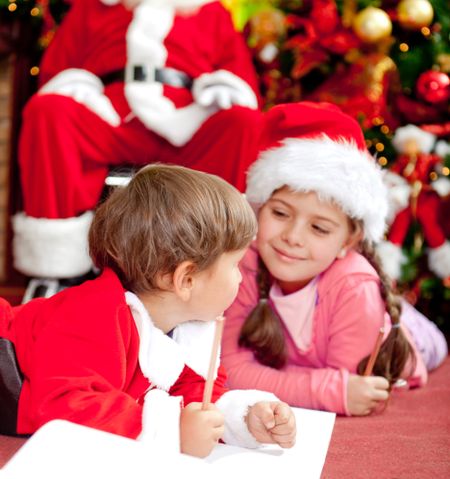 children-writing-christmas-letter-santa-claus-89866882 Children writing a Christmas letter for Santa Claus