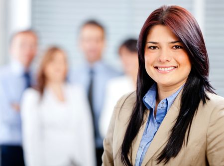 Successful woman leading a business team looking confident
