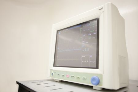 Medical monitor at the surgery room controlling vital signs