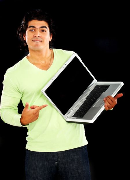 casual man with a laptop computer - isolated over a black background