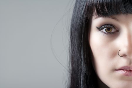 close-young-womans-face-black-hair-90235435 Close up of young woman's face with black hair