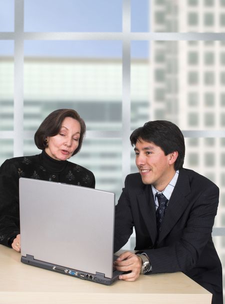 business couple with laptop in the office