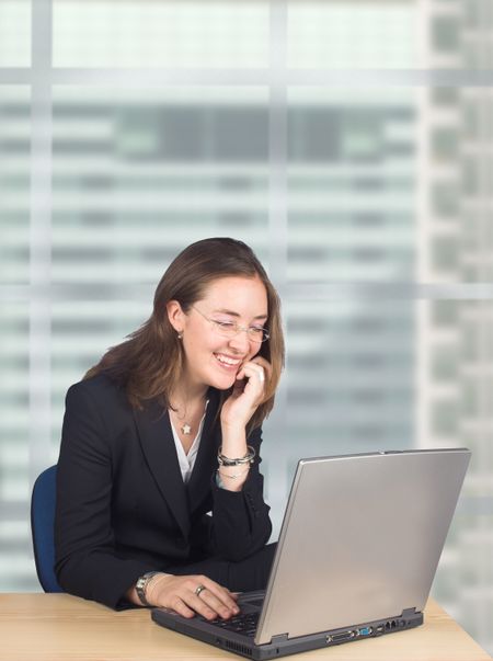 Business woman with her laptop on an office
